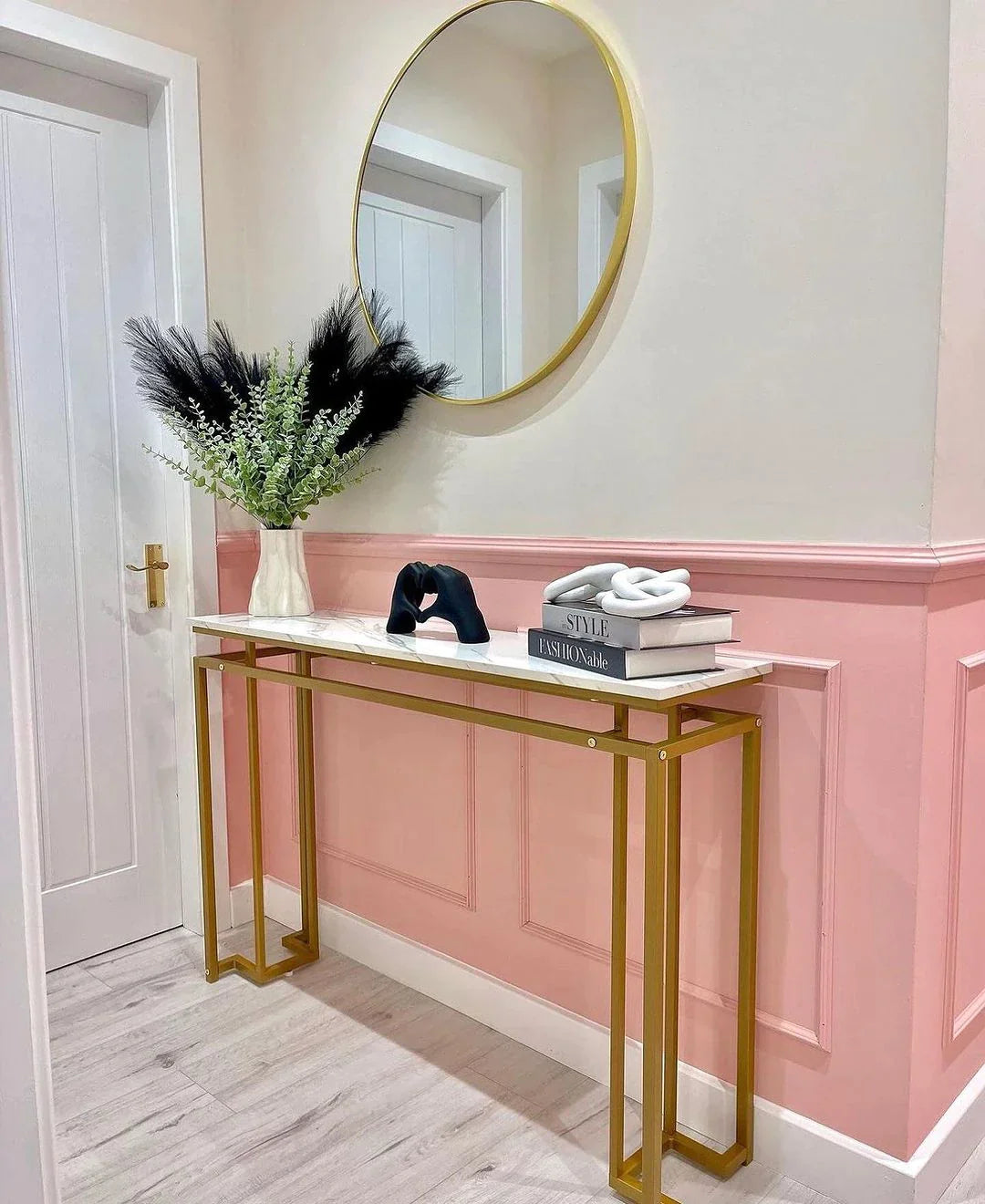 Wooden decorative mouldings adding depth and character behind an oak table, enhancing the ambiance.